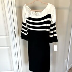 Body con sweater dress or tight knit. Beautiful dress. Off shoulder slightly.